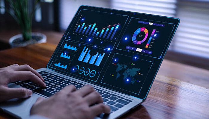 Financial crime User analyzing interactive data dashboards and graphs on a laptop screen to track insights and patterns associated with financial crime.