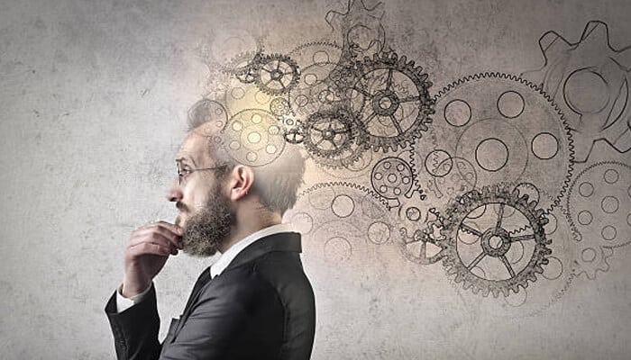 Business tycoons Executive visualizing interconnected gears and ideas, symbolizing strategic planning and long-term thinking.