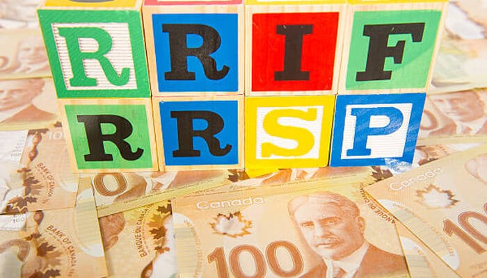 Converting rrsp to rrif | tycoonstory media Colorful alphabet blocks spelling out rrsp and rrif placed over canadian 0 bills, highlighting the concept of rrsp withdrawals and the transition to rrif.