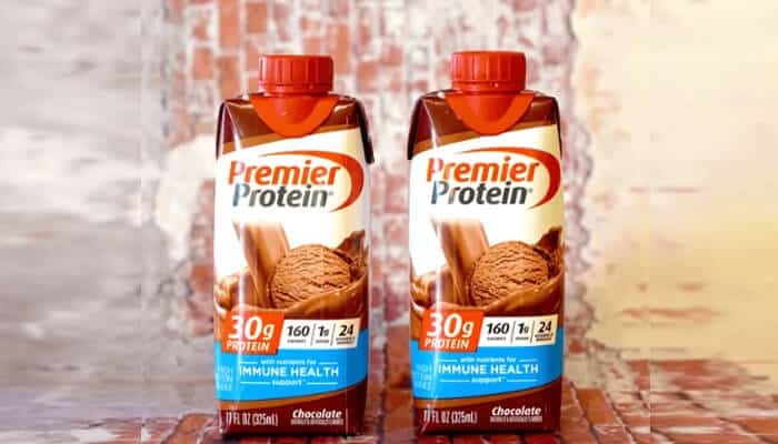 Premier protein | tycoonstory media Premier protein shake bottles on display, featuring a chocolate flavor, ideal for those seeking the best protein shakes for daily nutrition.