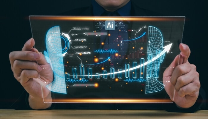 Three risk domains every ai compliance strategy must address | tycoonstory media Business professional analyzing futuristic digital charts and graphs on a transparent screen, illustrating ai in healthcare compliance and data-driven patient care strategies.