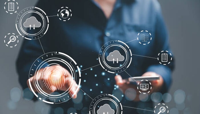 Access management and authentication | tycoonstory media Person interacting with a digital interface showing cloud icons and biometric access, illustrating cloud security controls, authentication systems, and secure data management technology.