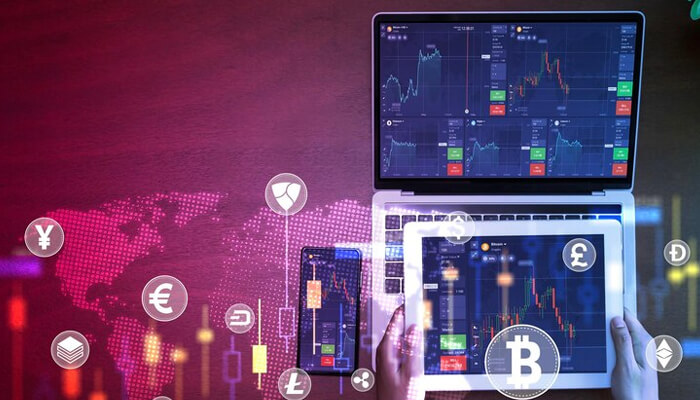 What distinguishes a cryptocurrency market making program | tycoonstory media Person interacting with a modern crypto liquidity desk, analyzing cryptocurrency market charts on a laptop and tablet, surrounded by various cryptocurrency icons and global financial data.