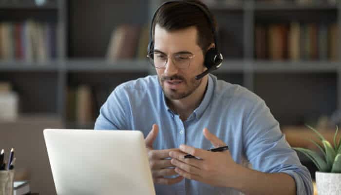 Why mentorship platforms are important | tycoonstory media Access matters more than advice: professional man using a laptop for a mentorship call, emphasizing the importance of access in career growth.