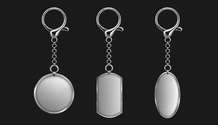 Why metal | tycoonstory media Three sleek custom metal keyrings displayed on a dark background, featuring different shapes with polished finishes, ideal for personalized branding and durable everyday use.