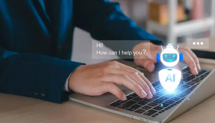 Ai productivity tools for interview preparation | tycoonstory media A person interacts with a virtual ai assistant on their laptop, showcasing the use of ai productivity tools to streamline tasks and enhance efficiency, such as during interview preparation.