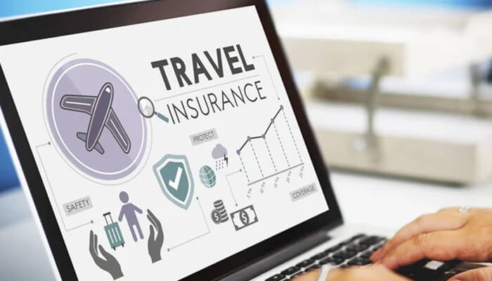 Cheapest travel insurance for frequent travellers | tycoonstory media A person reviewing the cheapest travel insurance options on a laptop, with icons representing safety, protection, and coverage for travelers.