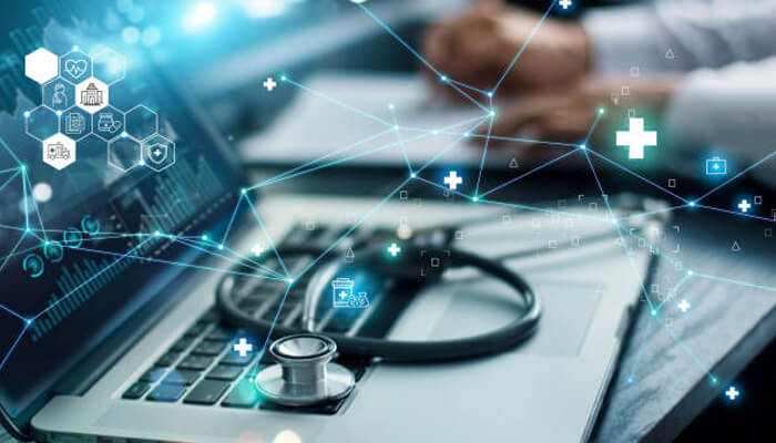 Market growth and industry demand | tycoonstory media Custom healthcare software solutions depicted through a laptop screen with a stethoscope, representing the integration of technology in healthcare to improve patient care and data management.