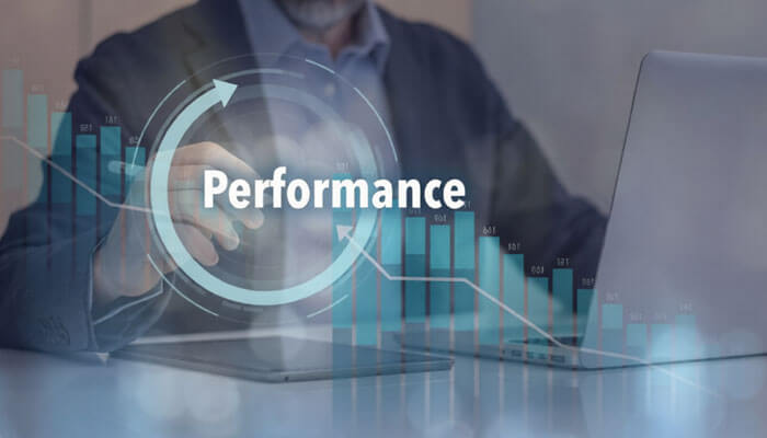 Performance optimisation and data handling | tycoonstory media A business professional analyzing performance data on a laptop, with a digital graph and performance metrics overlay. This represents the growth and optimization of mobile casino platforms.