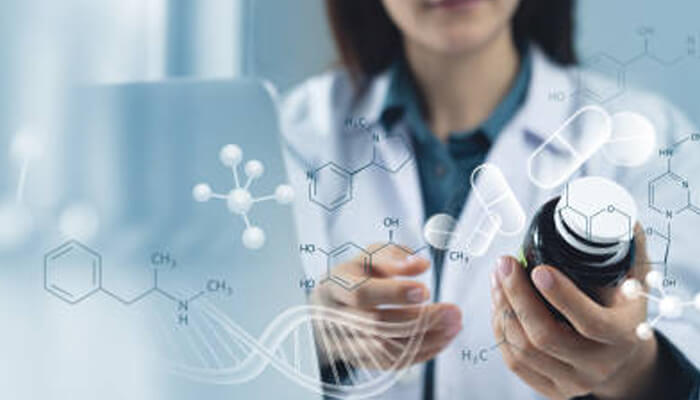 Potential mechanisms being studied in fenbendazole clinical research | tycoonstory media A researcher holding a bottle of medication while examining its potential effects. The image symbolizes ongoing fenbendazole clinical research, focusing on its mechanisms in scientific studies.
