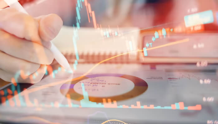 Why error correction defines the startup landscape | tycoonstory media A person analyzing data and charts, reflecting the importance of quantum error correction in improving data accuracy and performance in quantum computing systems.