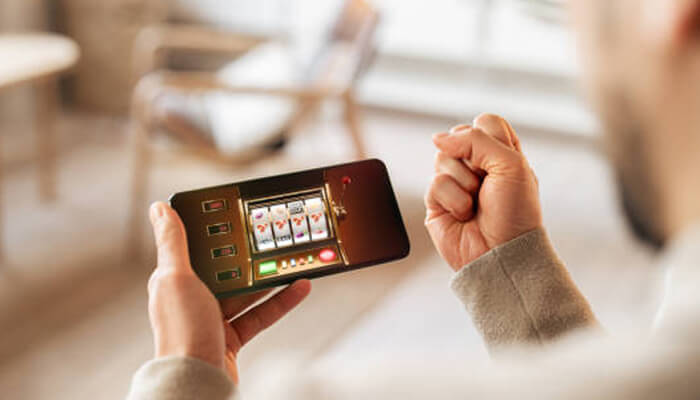 Winning strategies for qrpay44 slot games | tycoonstory media A person celebrating their win while playing slot games on a mobile device. Learn how to win big on qrpay44 by understanding game strategies and maximizing your chances.