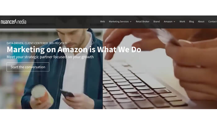 10 | tycoonstory media Hero banner for a marketing firm: headline 'marketing on amazon is what we do' with a person using a keyboard and phone, and a 'start the conversation' cta.