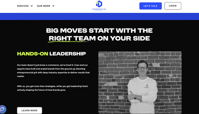 11 | tycoonstory media Hero section with bold white headline; shows a man in a white shirt standing against a brick wall on the right, dark background and navigation bar above.
