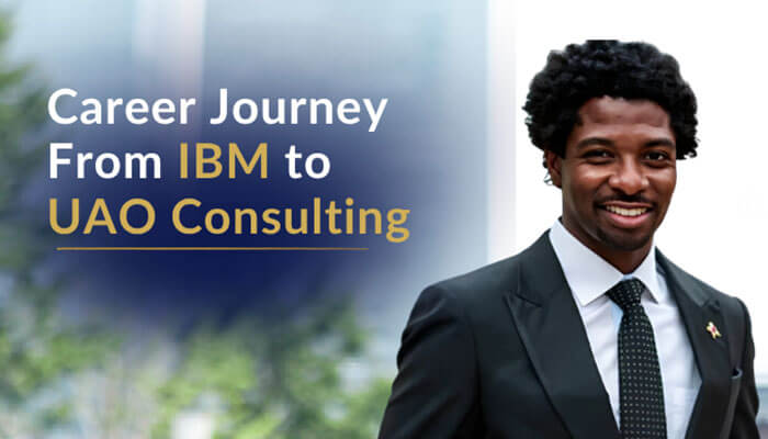 Career journey from ibm to uao consulting - tycoonstory | tycoonstory media Smiling man in a dark suit and tie stands on the right, with a blurred blue background and the headline: “career journey from ibm to uao consulting” on the left.