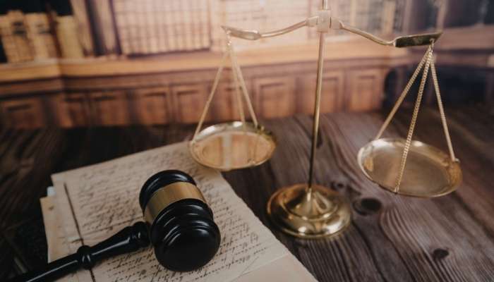Evidence | tycoonstory media Legal documents, scales of justice, and gavel representing an immigration court case and serious legal decision.