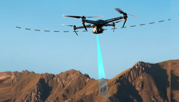 F 2 | tycoonstory media Quadcopter drone over rocky mountains, projecting a downward blue laser beam to map the terrain.