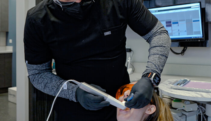 Top intraoral scanner for all-on-x implants - shining 3d aoralscan elite wireless | tycoonstory media Dentist using intraoral scanners to capture precise digital impressions, improving treatment accuracy and patient comfort.