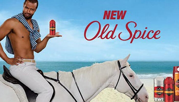 Old spice – the man your man could smell like | tycoonstory media Old spice – the man your man could smell like campaign featuring a shirtless man on a white horse holding a deodorant, illustrating successful pr campaigns with humor and memorable visuals.