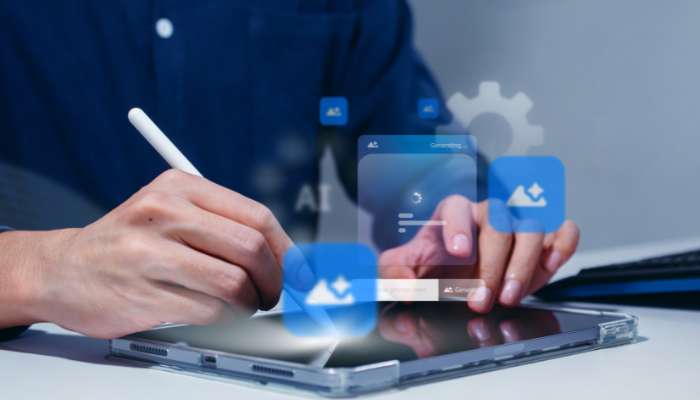 How ai image detection protects brand authenticity 1 | tycoonstory media Person using a stylus on a tablet with translucent blue ai and cloud icons hovering above the screen.