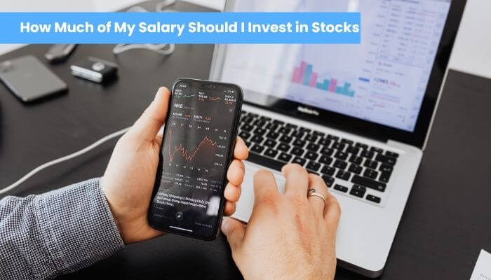 How much of my salary should i invest in stocks 1 | tycoonstory media How much should i invest in stocks based on salary with investor analyzing stock market data on a smartphone and laptop
