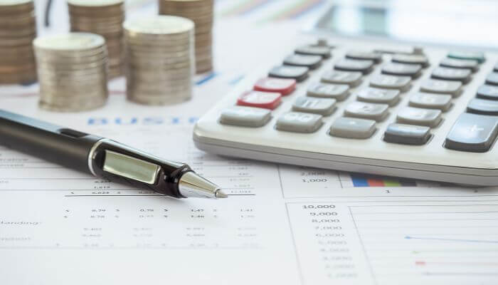 Loan and funding 1 | tycoonstory media Riverpoint capital business loans and funding concept with calculator, financial reports, and credit analysis tools