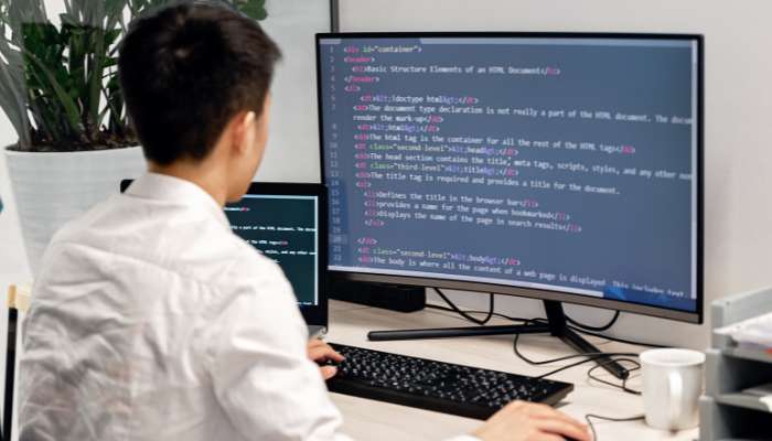 Python find string position in list | tycoonstory media Programmer writing python code on a desktop computer while learning python find string position in list methods for data processing and list searching.