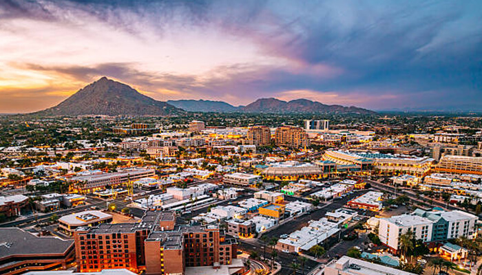 Specific arizona use cases | tycoonstory media Phoenix small-business owners managing mileage and tax records across the city skyline for smarter business travel tracking