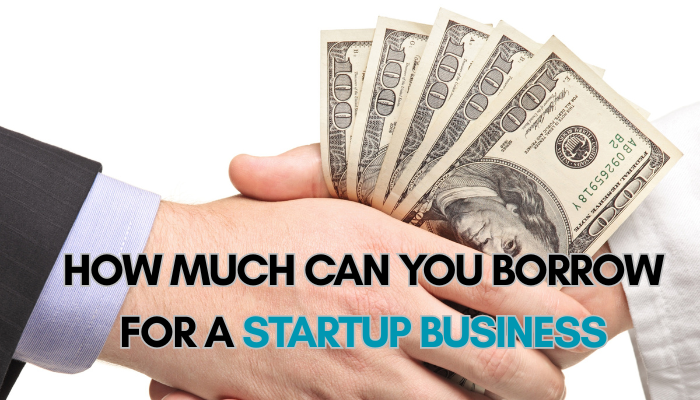 Startup loan 1 | tycoonstory media Business handshake with cash exchange representing startup funding and how to get a startup business loan with no money.