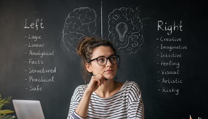 What does it mean to be left-brained or right-brained | tycoonstory media Person comparing left-brained or right-brained traits with logic and creativity notes on a chalkboard.