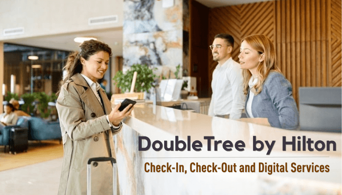 Doubletree by hilton - tycoonstory | tycoonstory media Doubletree by hilton front desk staff assisting a guest with check-in, check-out, and digital hotel services.