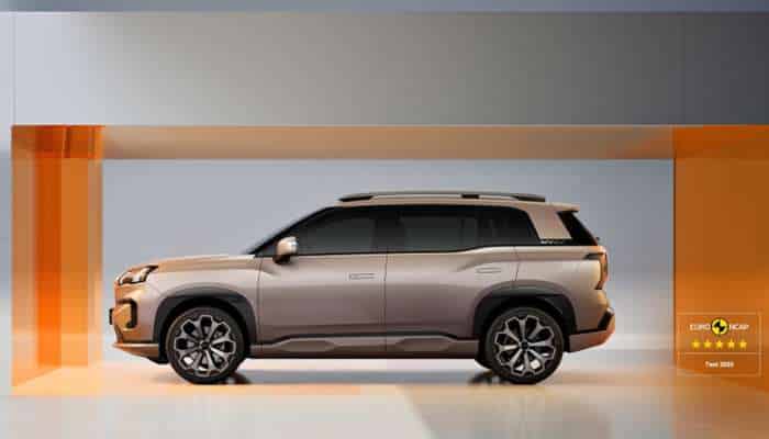 Best chinese electric cars in europe 2026 11 | tycoonstory media Silver suv on display in a bright showroom with orange glass panels; euro ncap 5-star rating badge visible on the right.