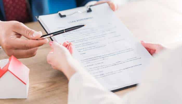 How to stay ahead as rates move higher | tycoonstory media Rates move higher concept showing financial paperwork and loan documents, highlighting changing interest rates and their impact on borrowing decisions.