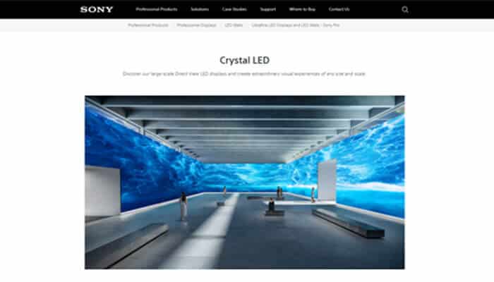 Sony corporation - tycoonstory | tycoonstory media Spacious showroom with white benches, viewing platform, and a bright blue crystal led wall display.