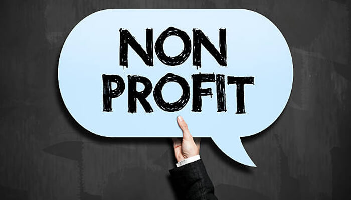How nonprofits are using portals to reduce — not add — administrative burden | tycoonstory media Nonprofit sign representing how nonprofit organizations use board portals to reduce administrative work and simplify governance.