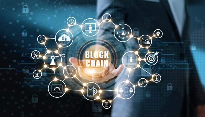 How blockchain ecosystems are creating new opportunities in sports and entertainment 1 | tycoonstory media Glowing blockchain network with icons around a central 'block chain' label.