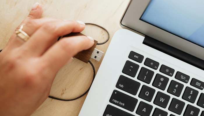 How to boot from a usb drive | tycoonstory media What is bios boot order guide showing a user connecting a bootable usb drive to a laptop for startup configuration and operating system installation.