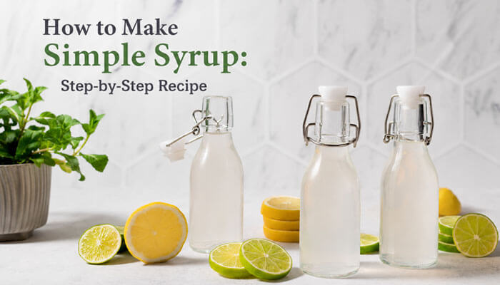 How to make simple syrup: step-by-step recipe - tycoonstory | tycoonstory media Make simple syrup step-by-step using a clear homemade 1:1 sugar and water recipe shown in glass bottles on a kitchen counter with fresh lemon and lime slices, illustrating citrus-infused variations of simple syrup for cocktails, iced tea, lemonade, and mocktails in a clean, modern kitchen setup.