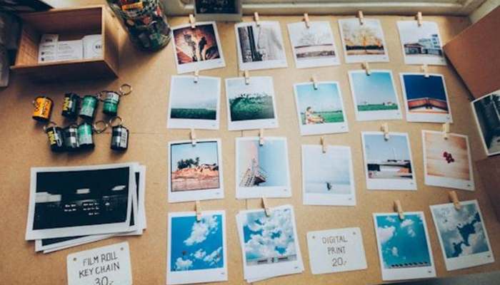 How to sell your car in brisbane quickly and without hassle | tycoonstory media Mood board with many polaroid photos pinned to a corkboard, plus scattered film canisters and notes.