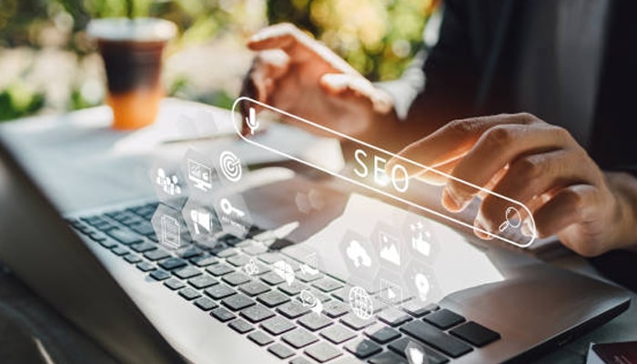 Seo | tycoonstory media Seo automation tools displayed on a laptop with digital marketing analytics for improving website performance.