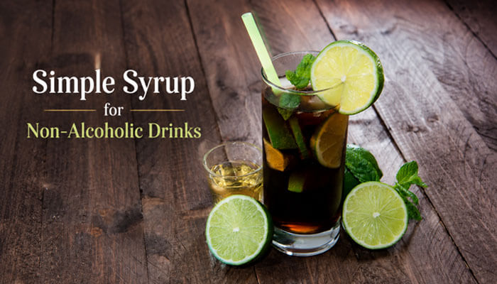 Simple syrup for non-alcoholic drinks - tycoonstory | tycoonstory media Make simple syrup infused non-alcoholic beverage featuring a refreshing iced drink with citrus slices and mint served on a wooden table, demonstrating how make simple syrup enhances flavor balance in mocktails, lemon-lime coolers, iced teas, and homemade summer drinks by providing smooth, fully dissolved sweetness without sugar granules.