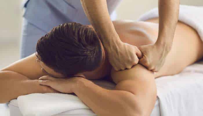 Therapeutic massage 1 | tycoonstory media Professional therapeutic massage destin therapist performing deep tissue back and shoulder massage for injury recovery and muscle relaxation