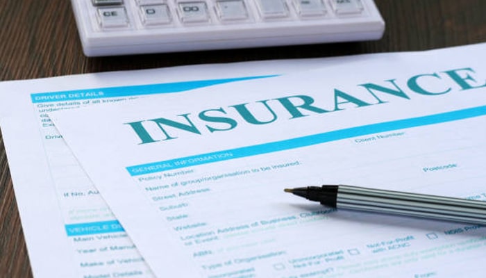 Untitled-1 | tycoonstory media Insurance document with pen and calculator representing policy review and insurance license verification for legal and financial compliance.