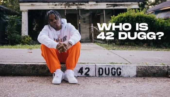 Who is 42 dugg 1 | tycoonstory media 42 dugg height comparison image showing detroit rapper 42 dugg sitting outdoors, highlighting the widely reported 5 feet 2 inches height in 2026
