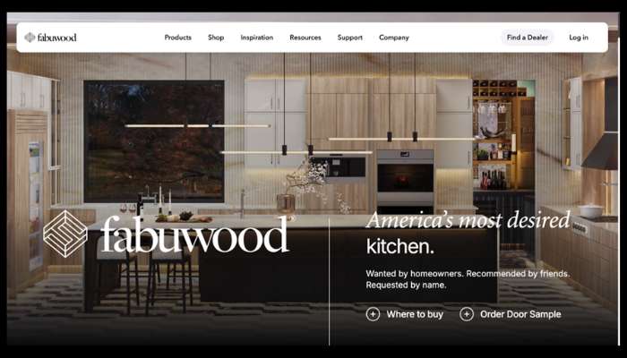 Wholesale cabinetry distribution 1 | tycoonstory media Modern kitchen showroom with light wood cabinetry, island, and pendant lights; fabuwood logo and 'america's most desired kitchen' slogan.