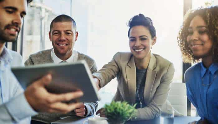 Why businesses are ditching instantly and what theyre moving 1 | tycoonstory media Businesses team collaborating with digital devices to discuss strategies, ideas, and professional solutions.