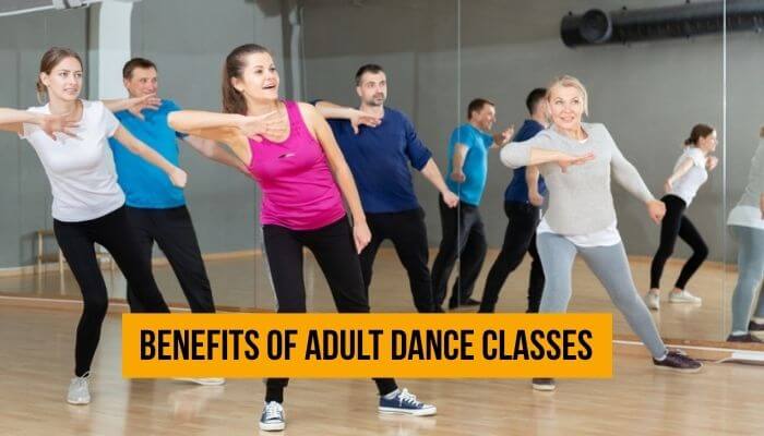 Mirror image dance company - tycoonstory | tycoonstory media Mirror image dance company adult dance class with men and women practicing dance moves in a studio, showing fitness, confidence, and group learning.