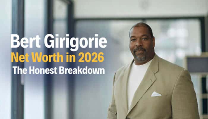 Bert girigorie net worth in 2026 the honest breakdown - tycoonstory | tycoonstory media Professional portrait of bert girigorie standing in a modern office setting, dressed in a beige suit, with on-image headline “bert girigorie net worth in 2026 – the honest breakdown,” highlighting research-based insights into bert girigorie net worth, his marketing career, and long-term professional growth in the business industry.