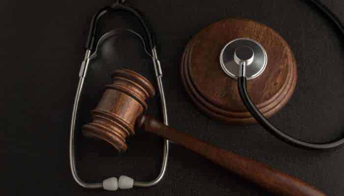 Cerebral palsy 1 | tycoonstory media Gavel and stethoscope on a dark surface, symbolizing medical law or healthcare jurisprudence