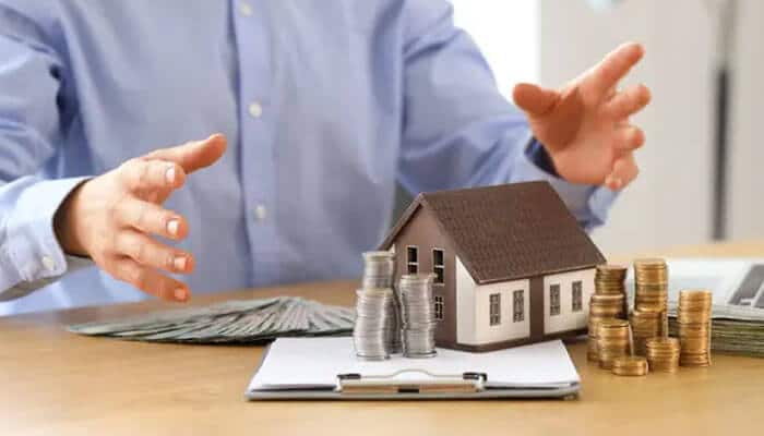 You have built significant equity you are not using - tycoonstory | tycoonstory media Low mortgage rate financial planning with homeowner reviewing mortgage costs, property value, savings, and real estate investment options